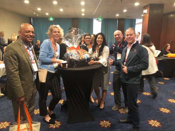 Cypress at Golden Gate senior living facility in San Francisco, California won the Outpatient raffle at CALA Elevate. This photo shows the winners with their prize.